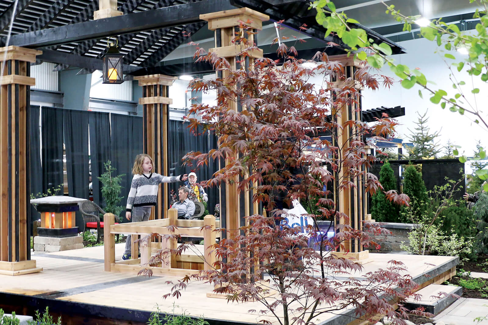 two kids in a display garden at the home show