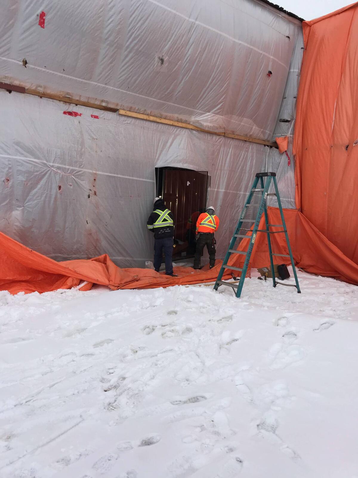 workers installing a window