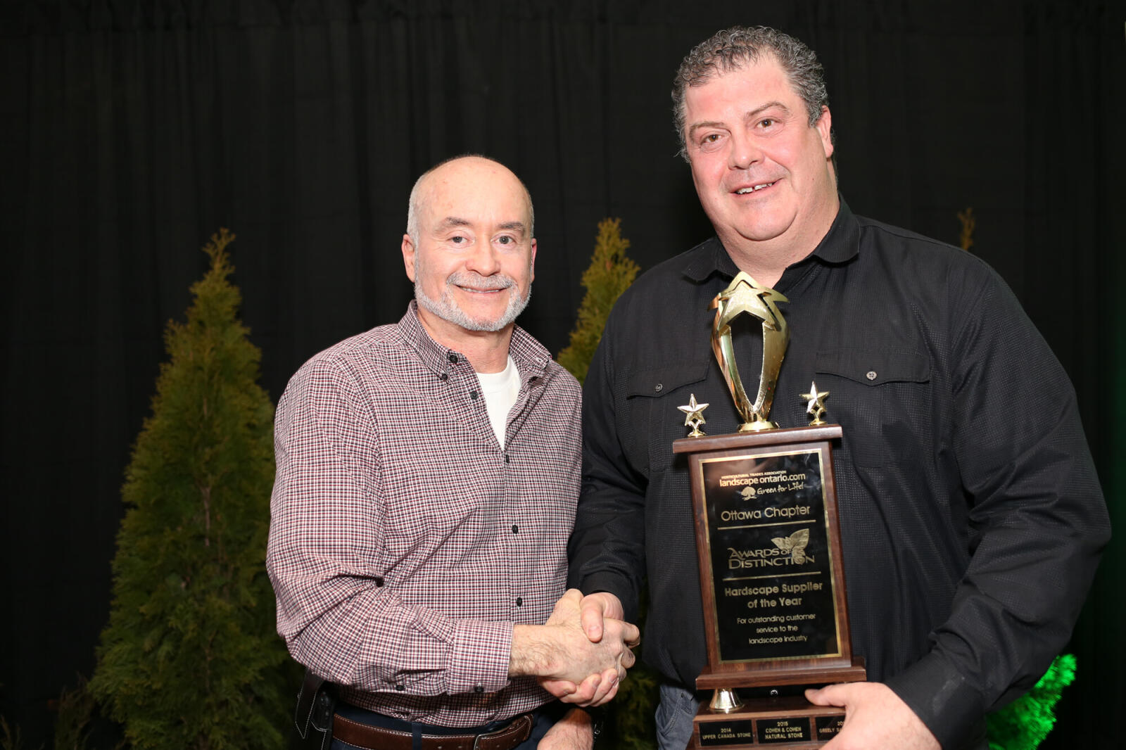 man accepting an award