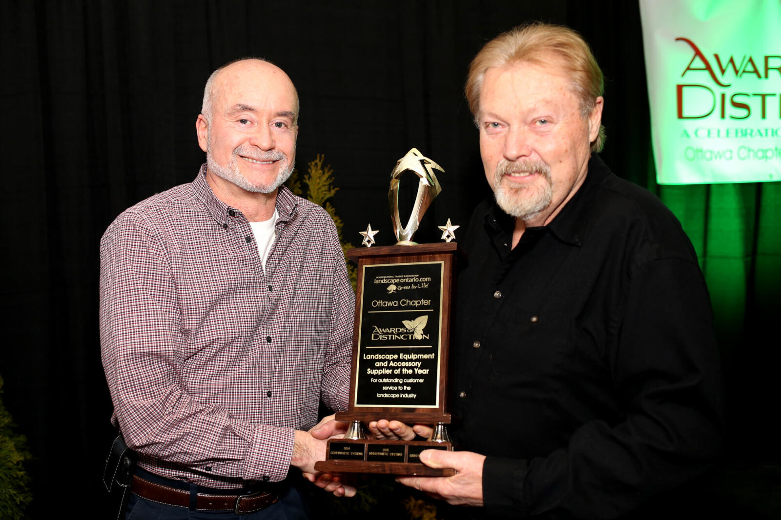 man accepting an award