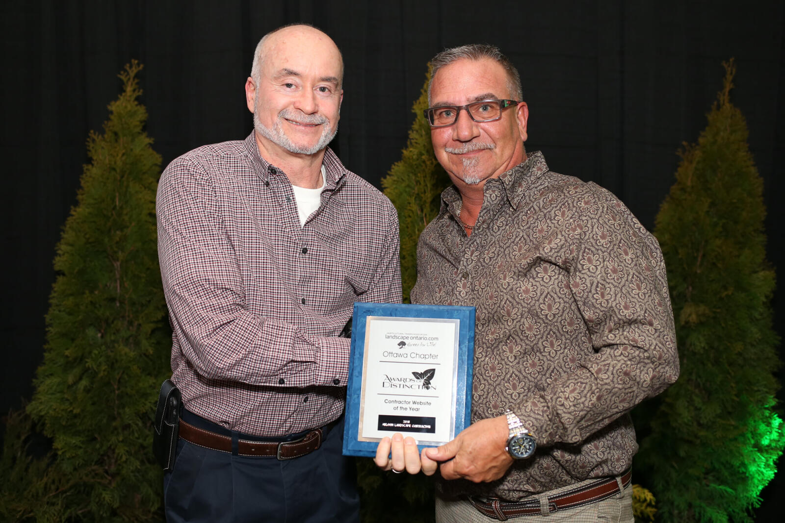 man accepting an award