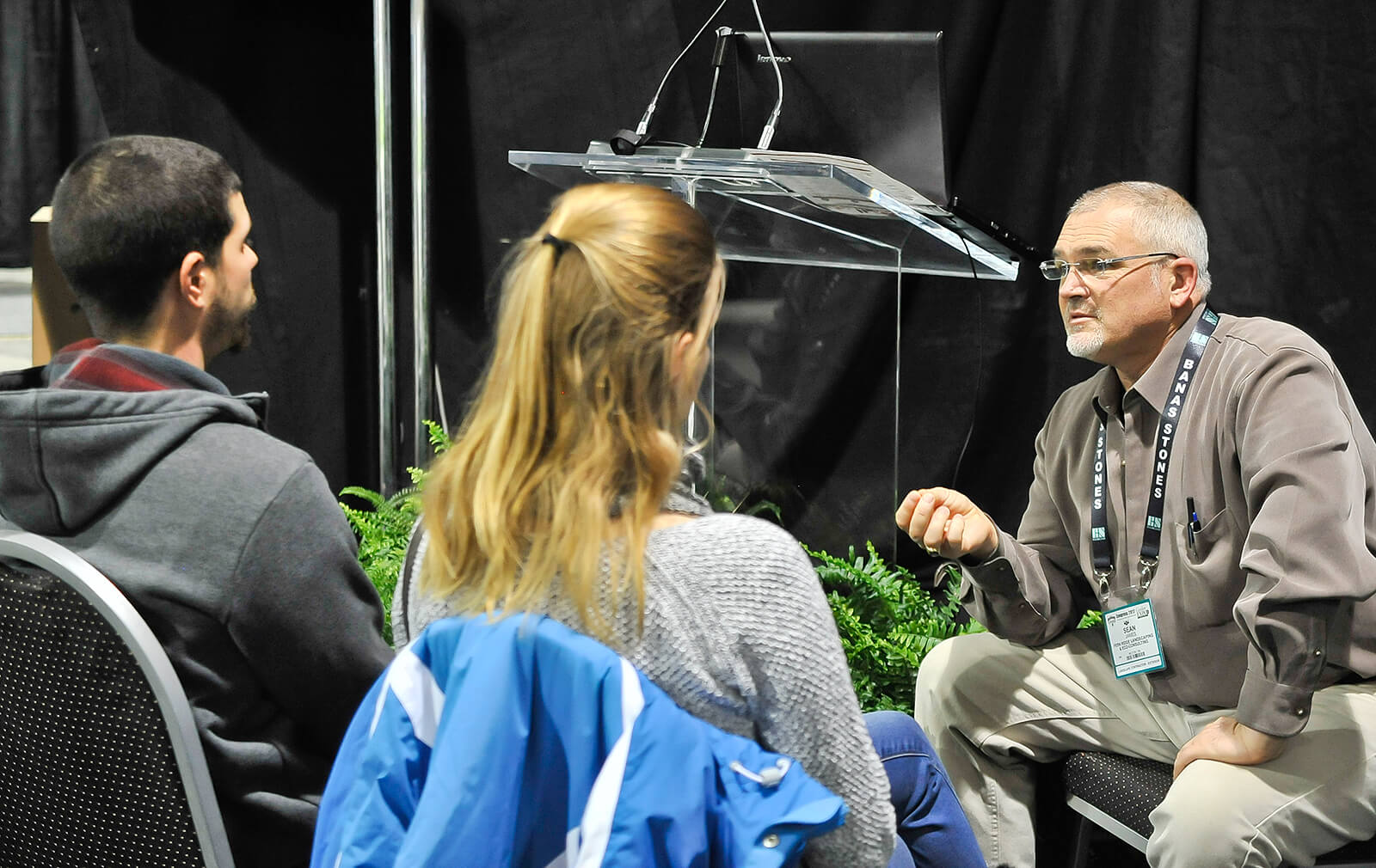 speaker talking with audience members
