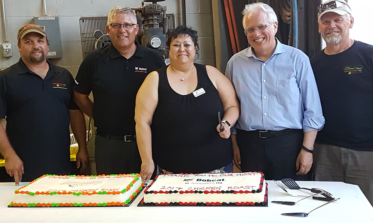 people about to serve a cake