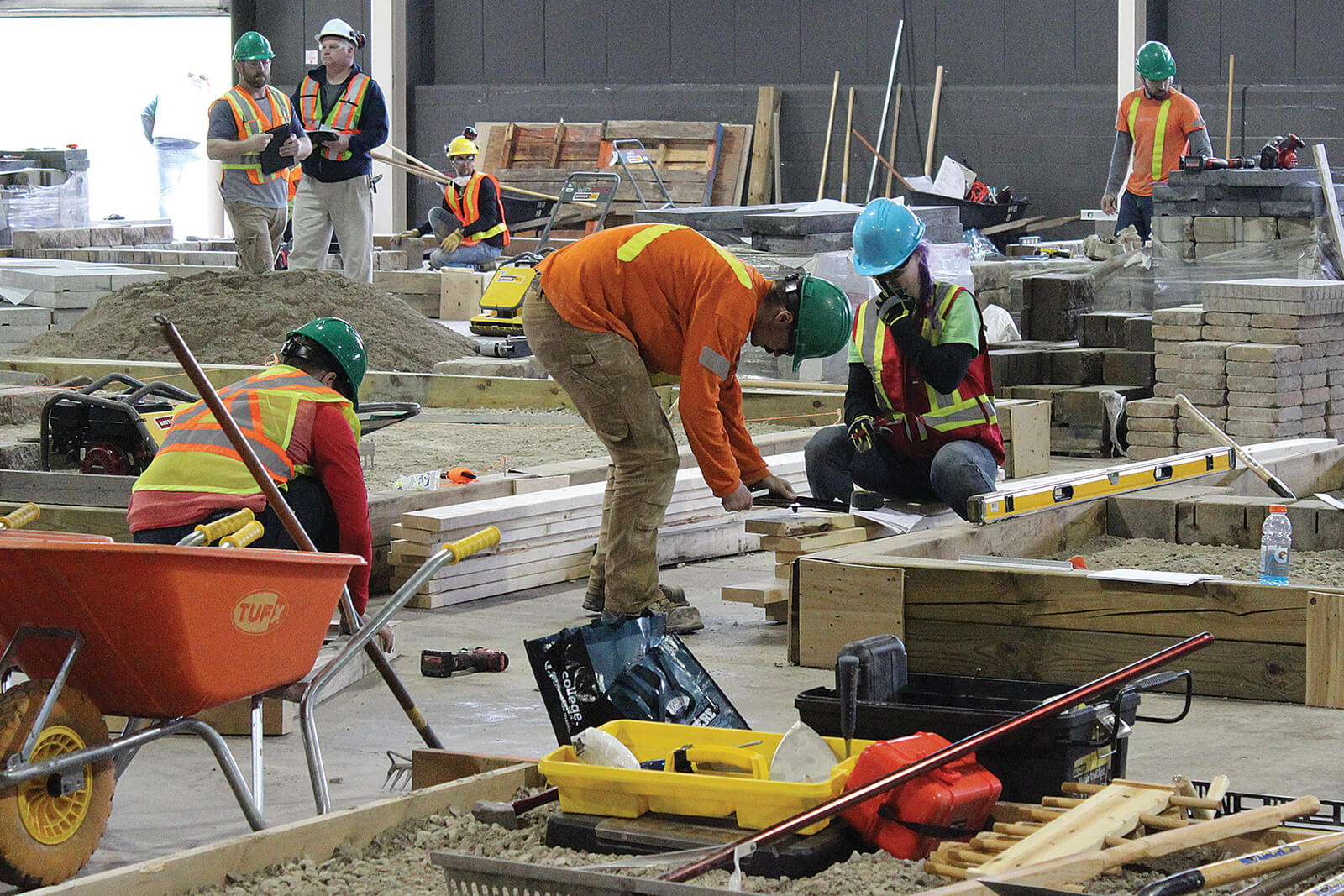 team working on building an indoor landscape garden