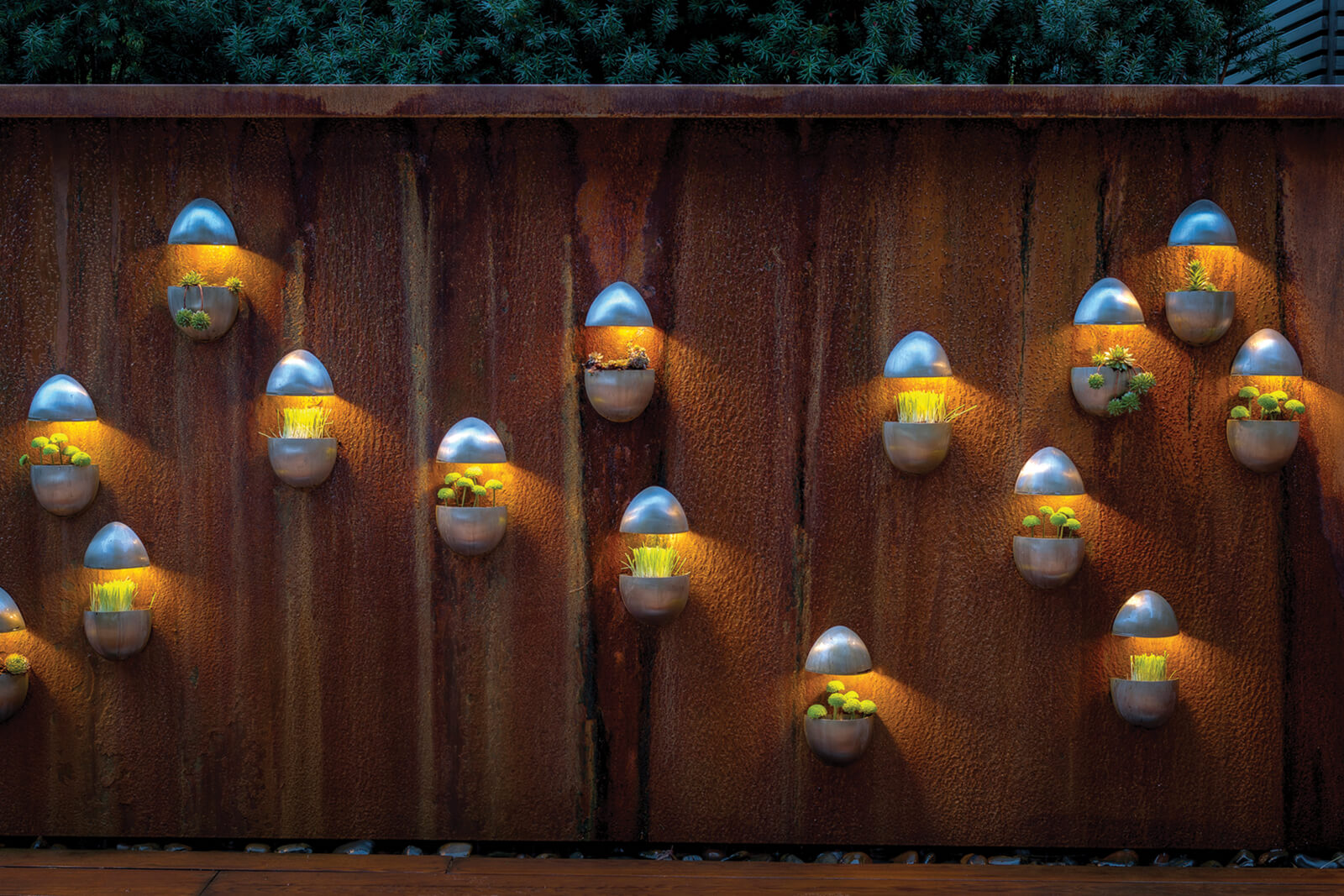 wood wall with plants in egg shaped planters