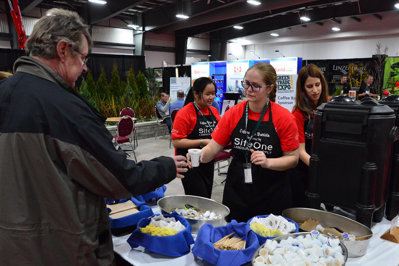 students serving coffee