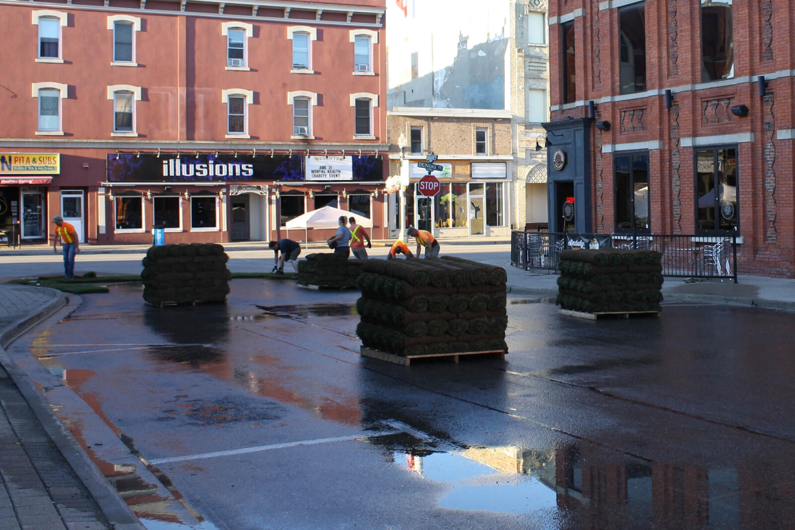 skids of sod on an empty street