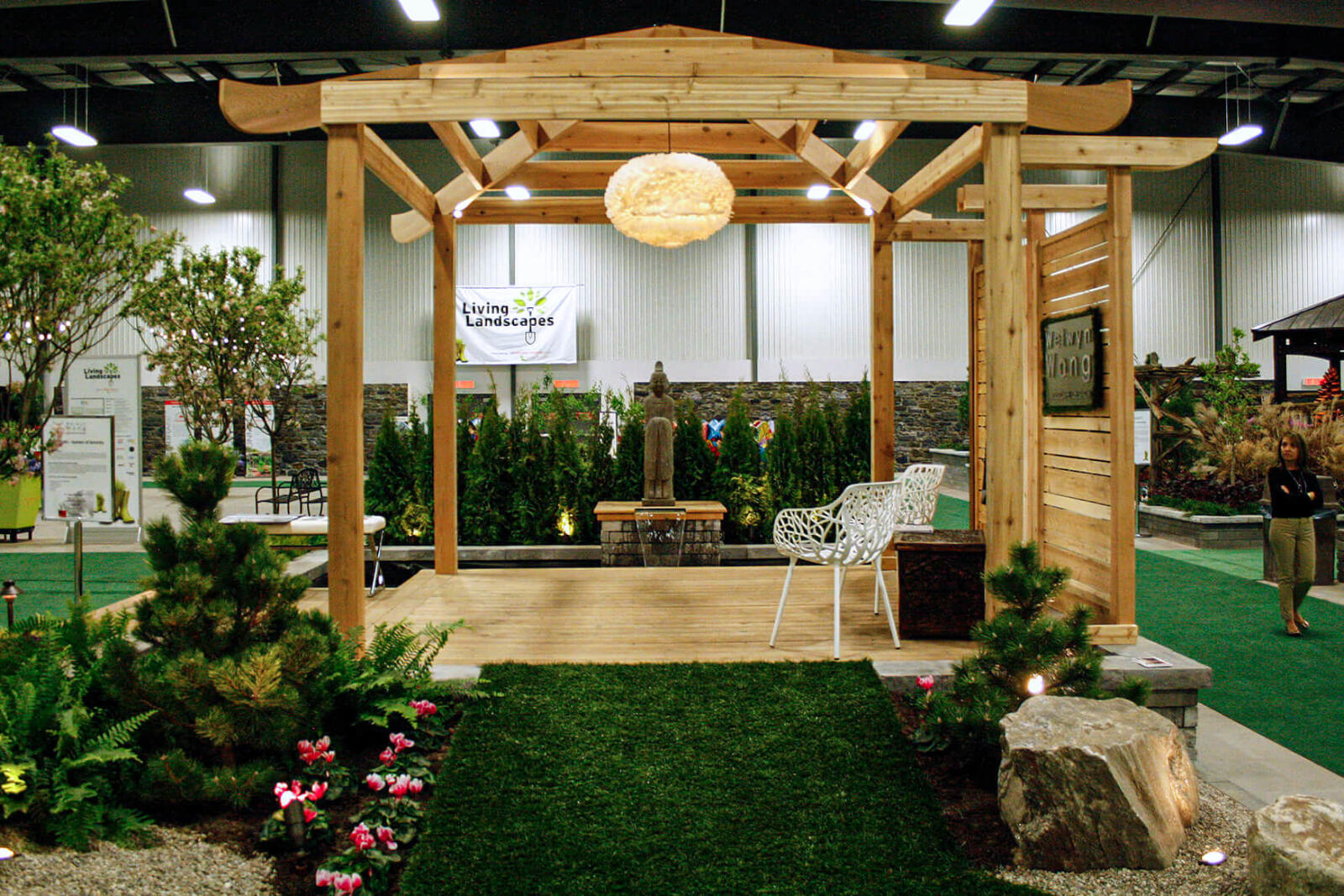 large wooden arbor in a garden
