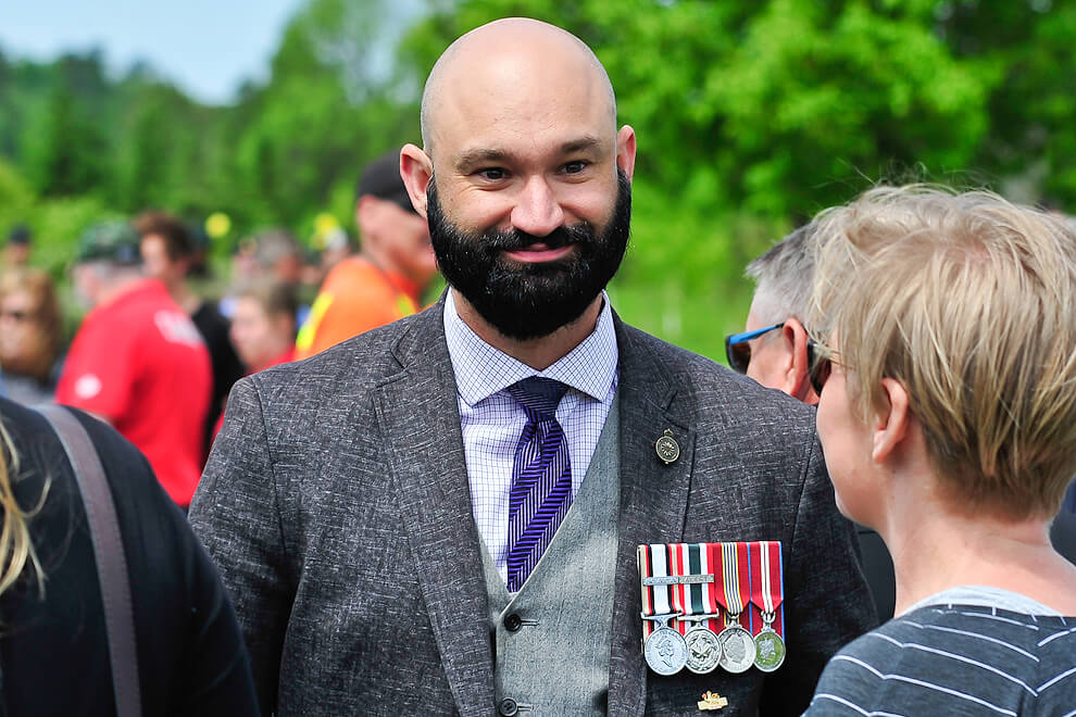 man in suit with army medals on his jacket