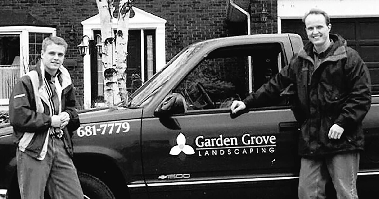 old photo of paul and david lammers standing in front of a company pick up truck