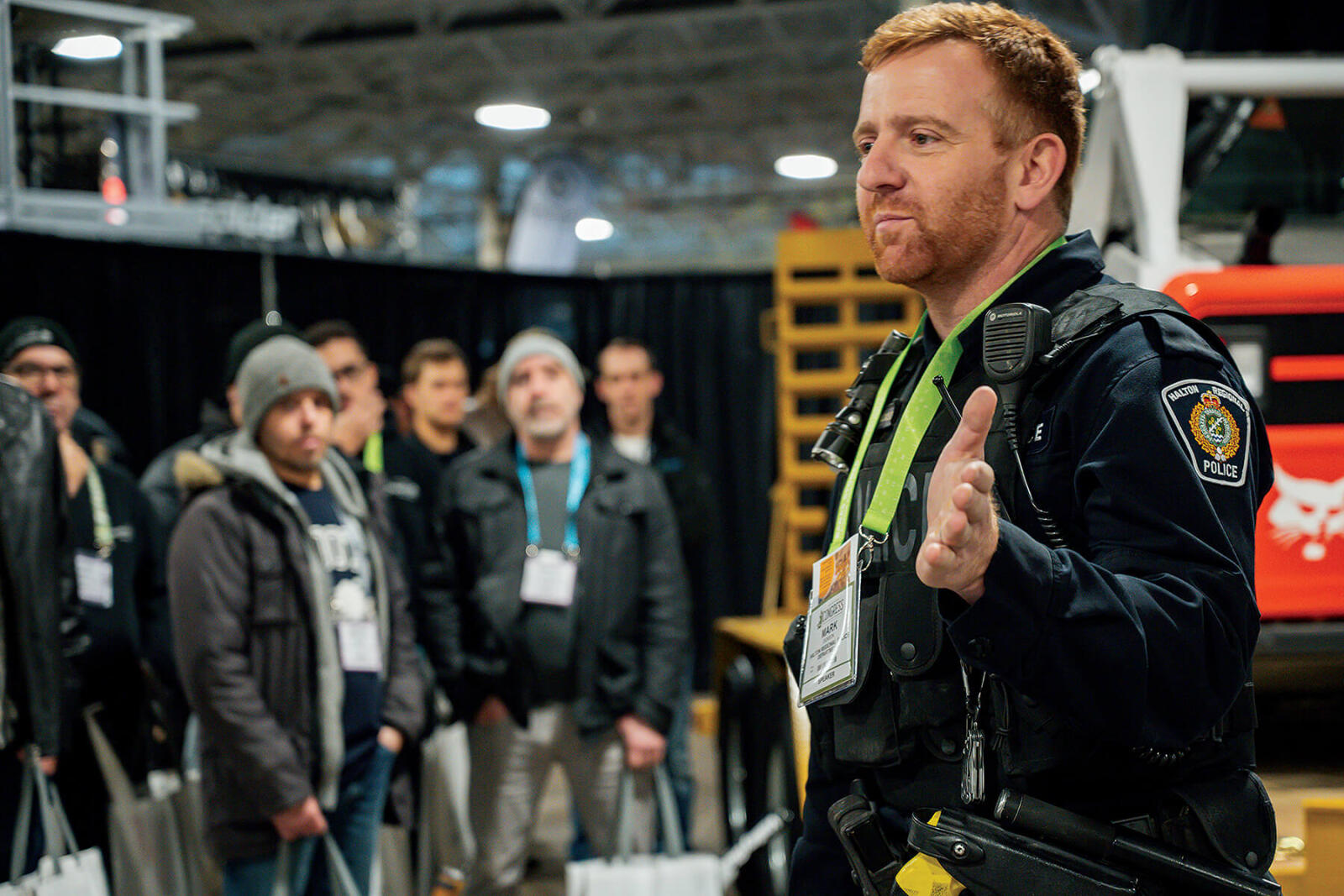 police officer talking to a large group