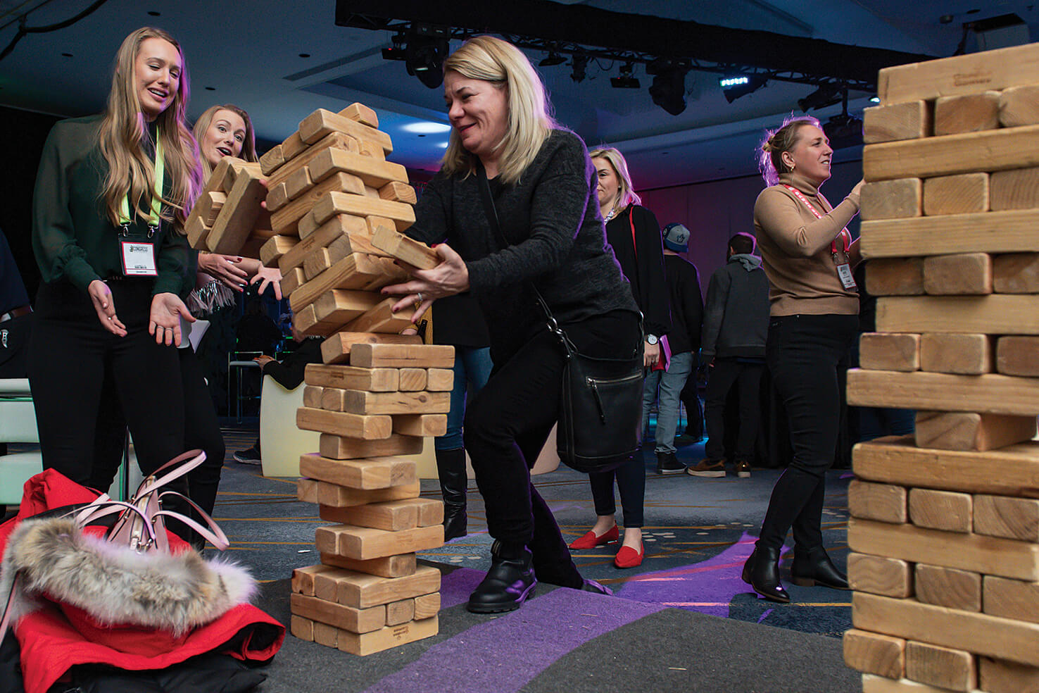 three women playing a puzzle game at a party