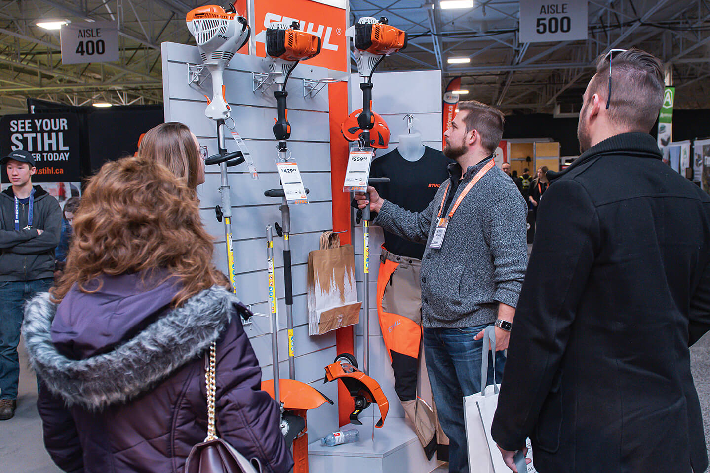 man looking at a display of power tools