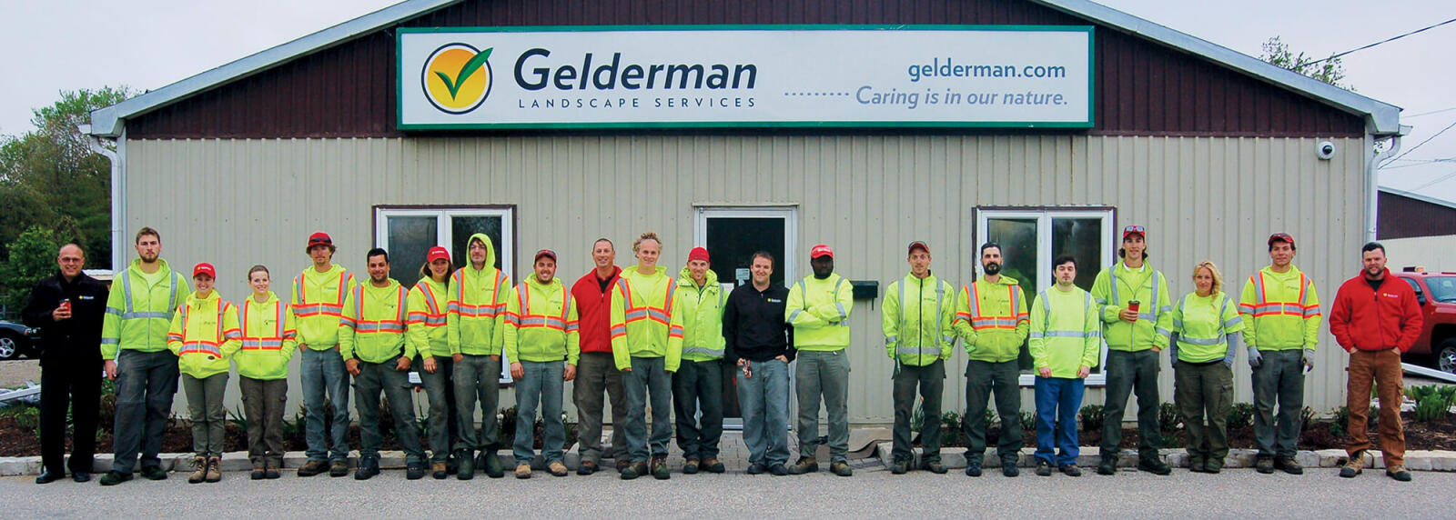 large group of workers outside their company building
