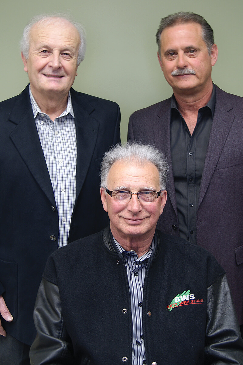 three men posing for a photo
