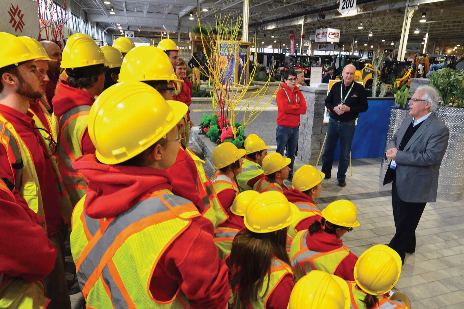 man talking to a group of students