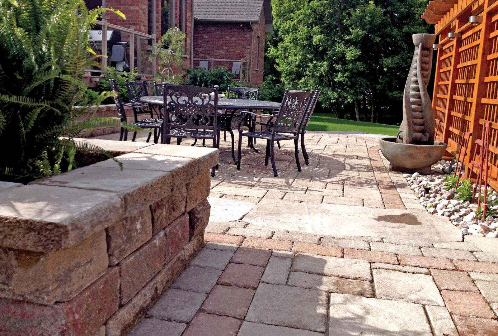 backyard patio with arbor and patio set