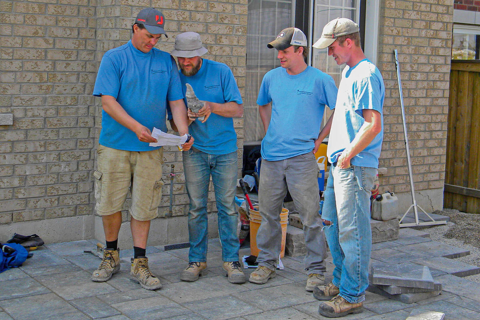 four men gathered around