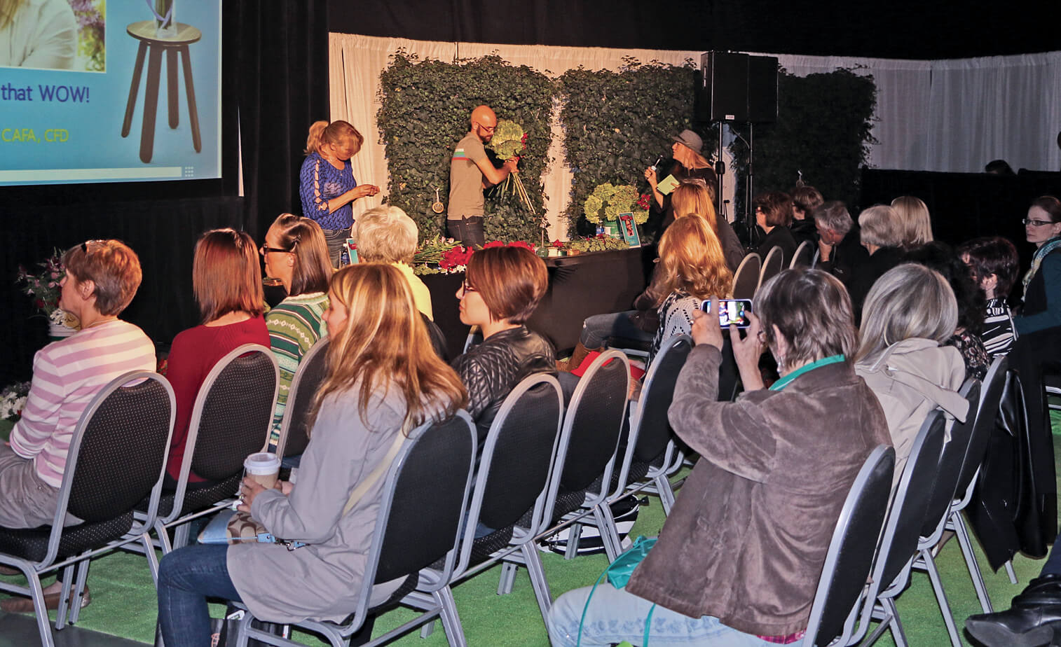 women giving a seminar to a crowd