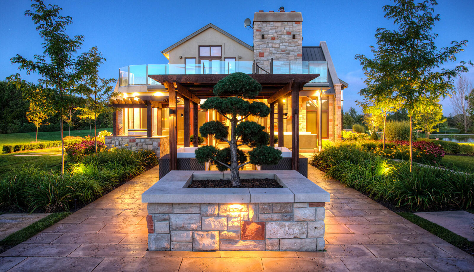 house with topiary in backyard as a focal point