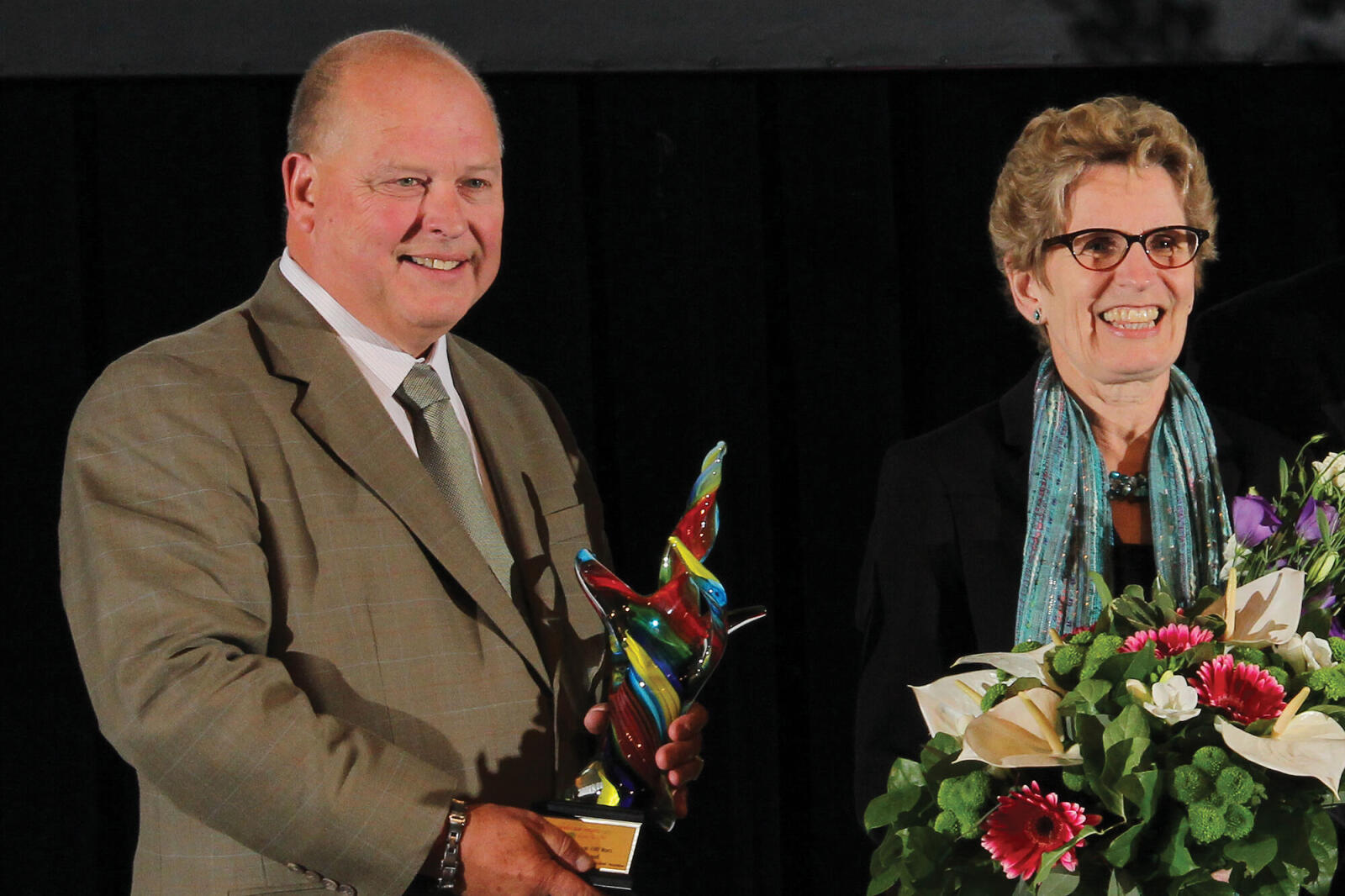 man and woman on stage