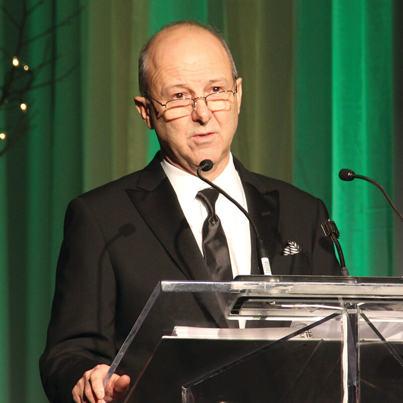 man at a podium speaking