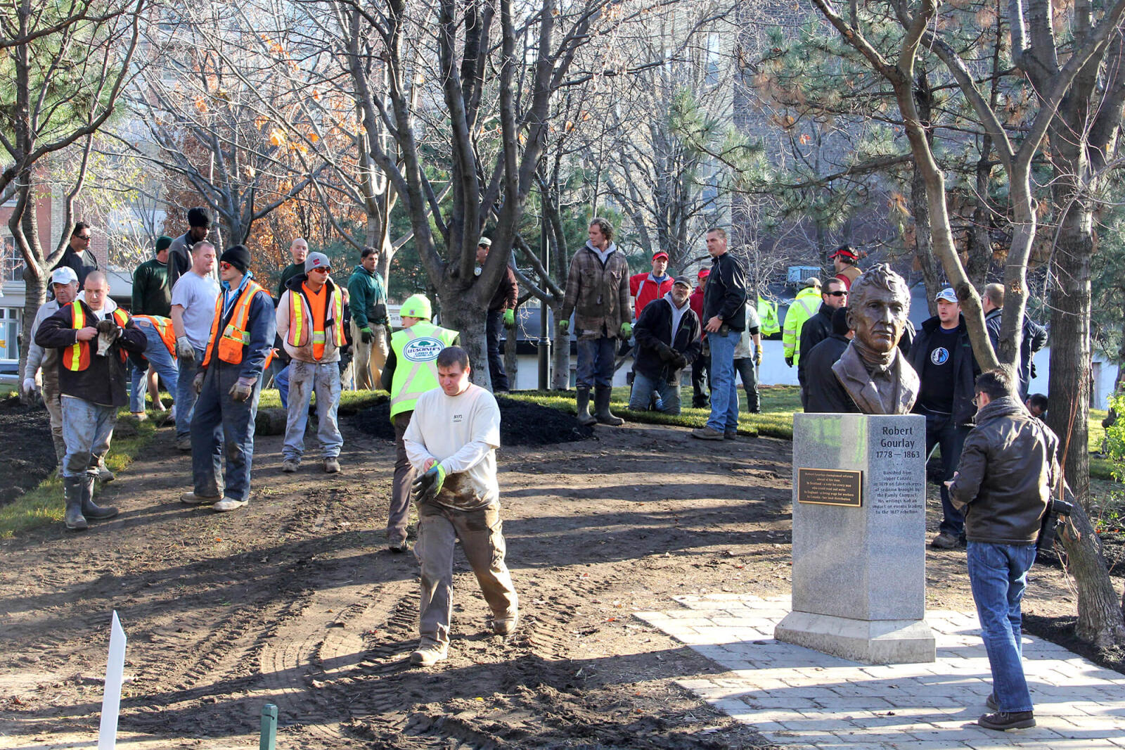 volunteers taking a break from laying sod