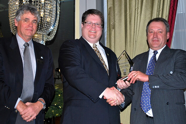 man presenting an award