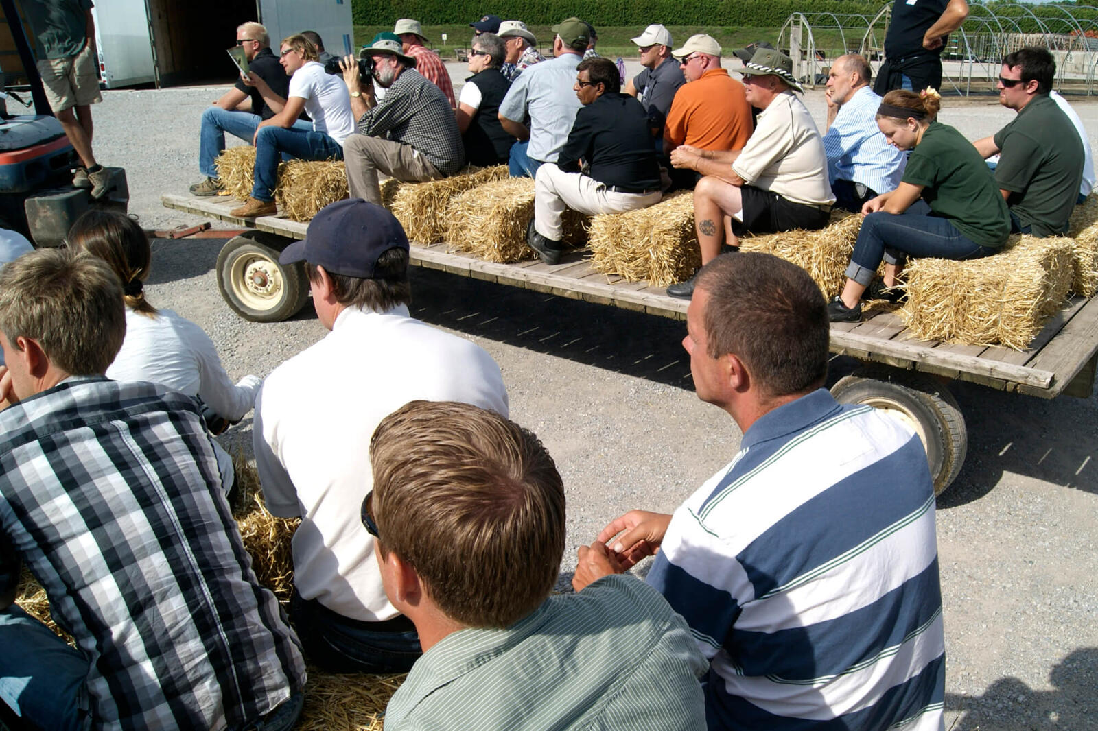 people on a wagon ride tour of a nursery grower