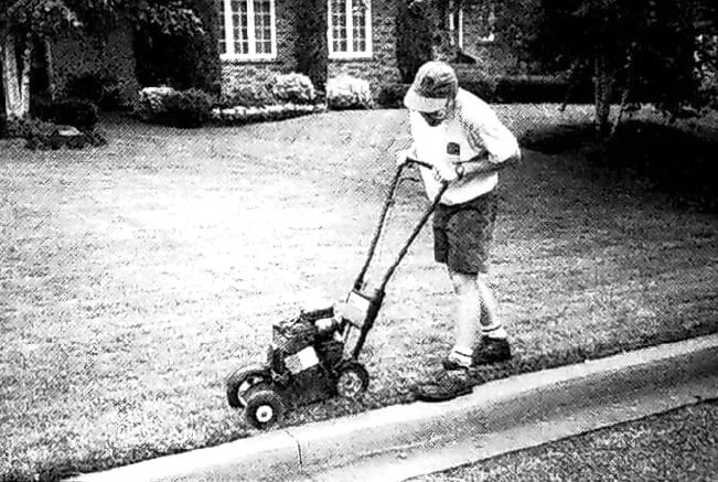 man using a small edger