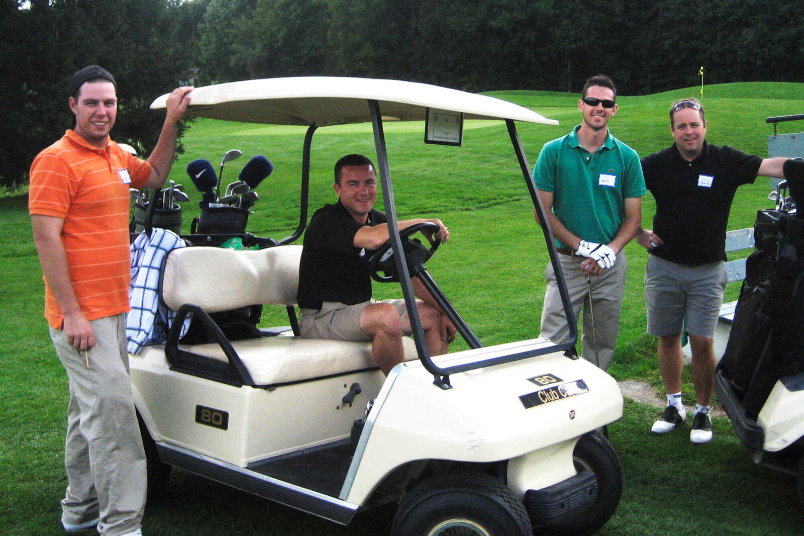 4 men on a golf course