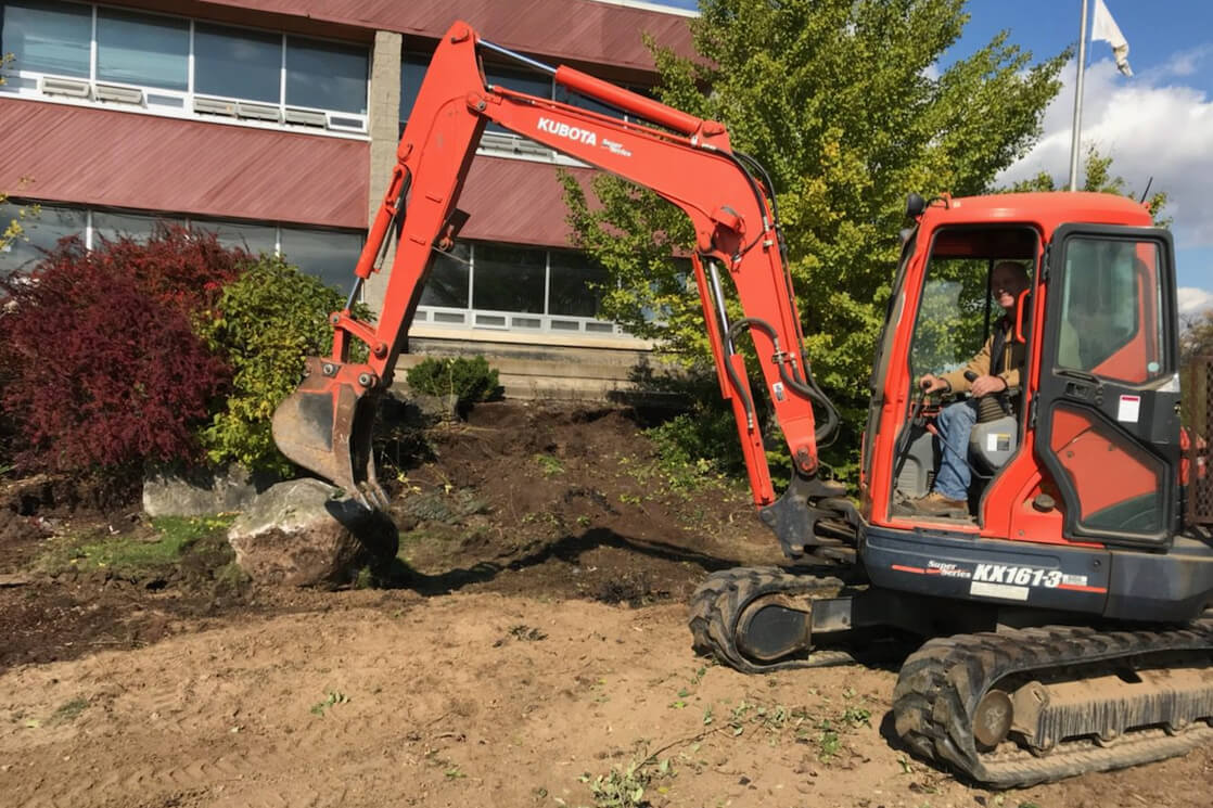 man operating a backhoe