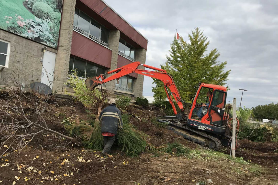 men doing excavation with a machine