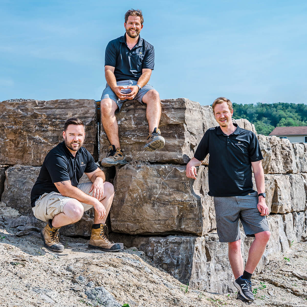 three men standing outside