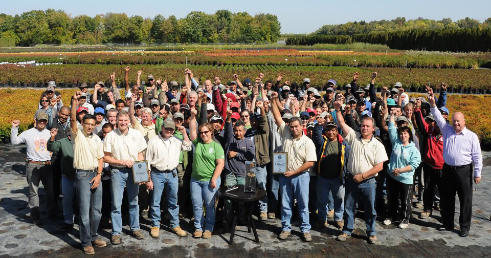 large group of people outside cheering