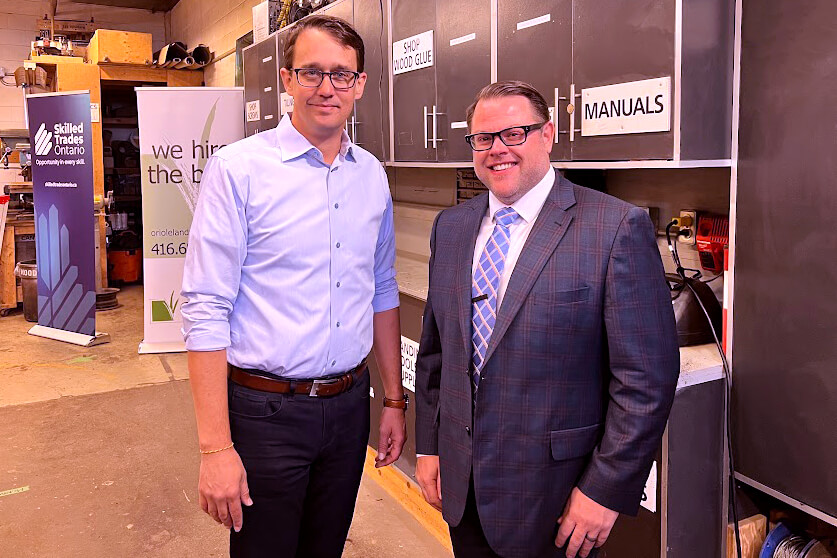 two men posing for a photo