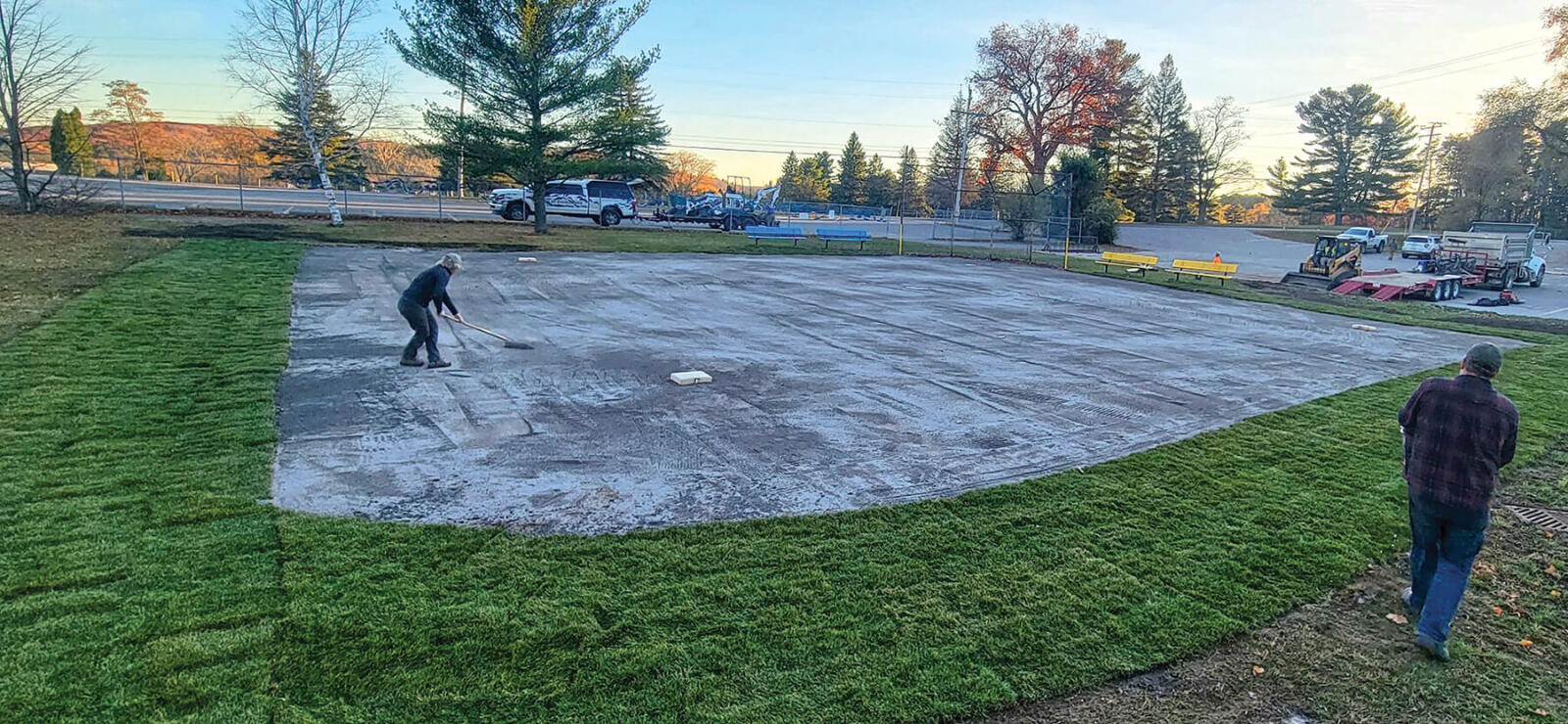 people working on a baseball diamond