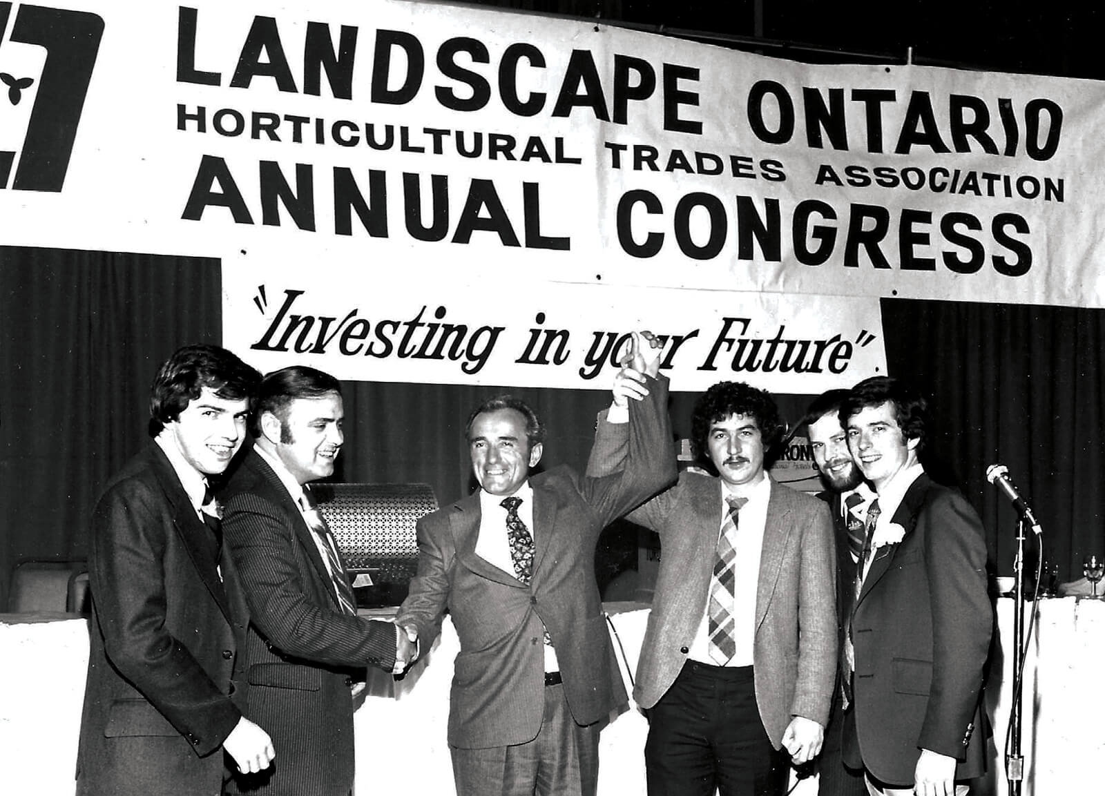 men holding a banner