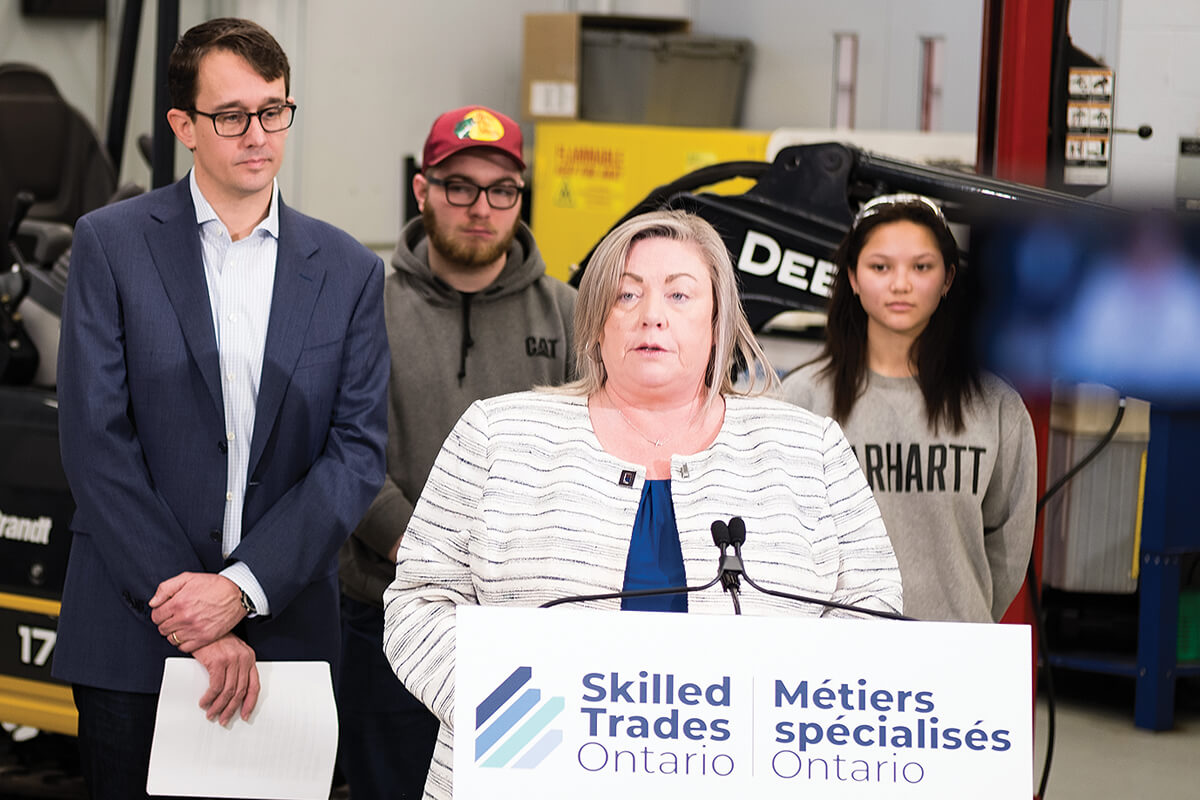 woman speaking at a podium