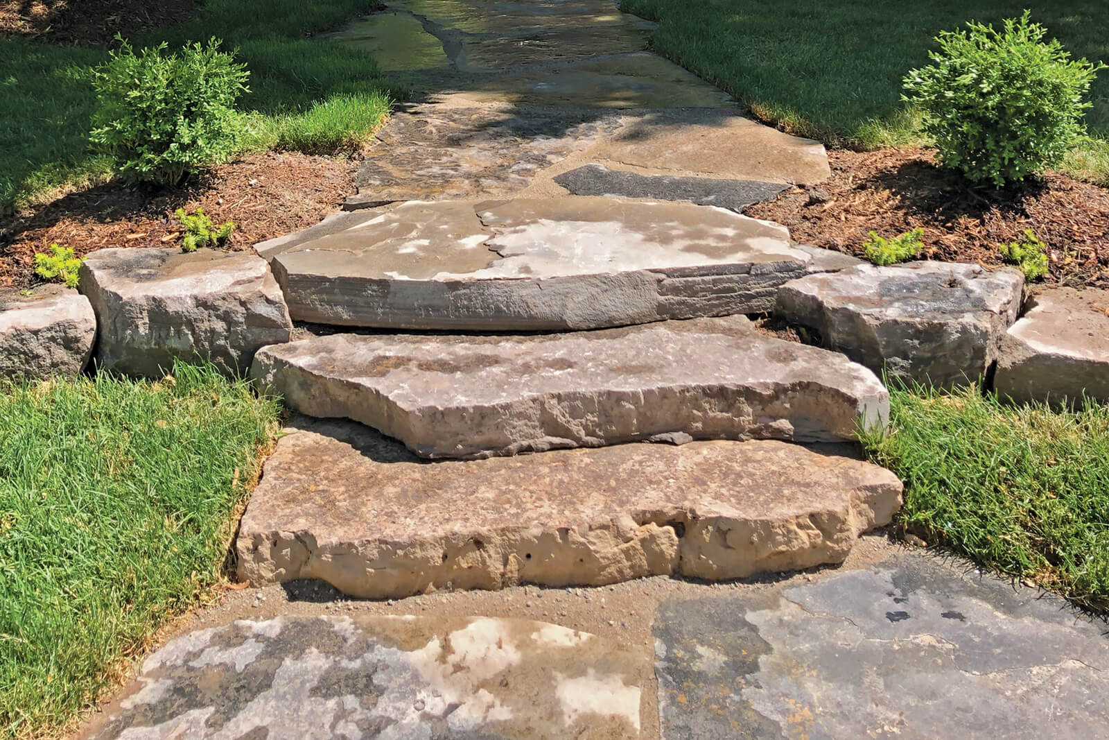 natural stone steps leading up to a house