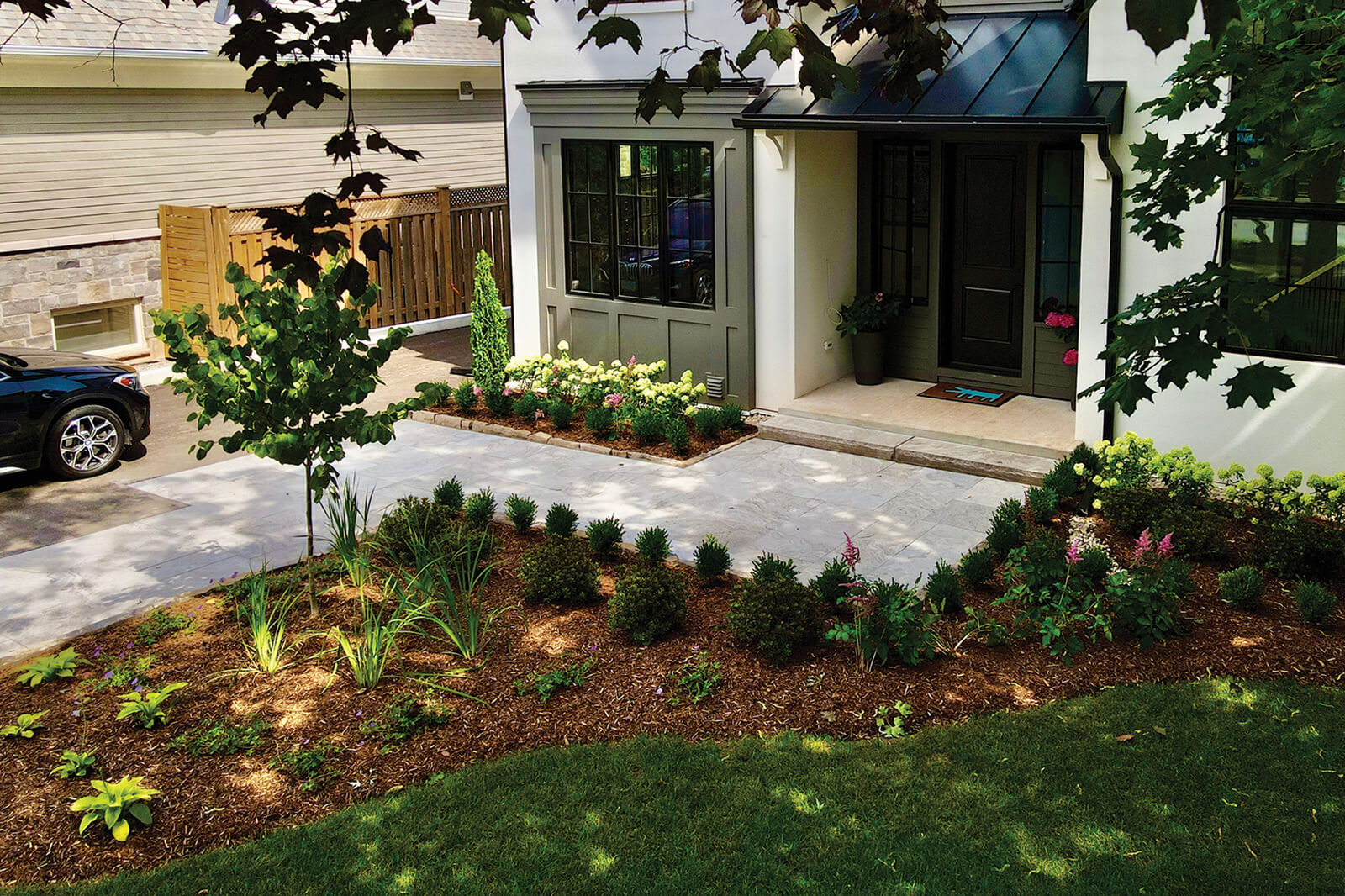 Front entrance to a house nicely landscaped