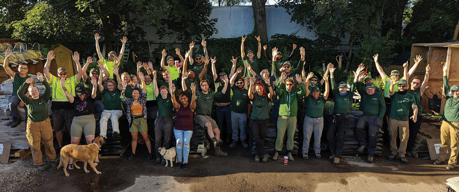 large group of workers outside cheering
