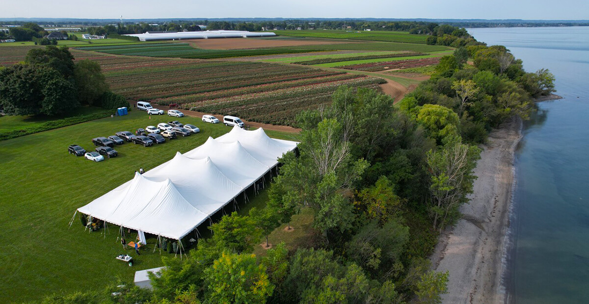 aeriel shot of a tent by the lake