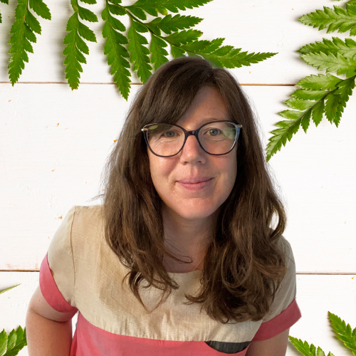 woman with long hair and glasses