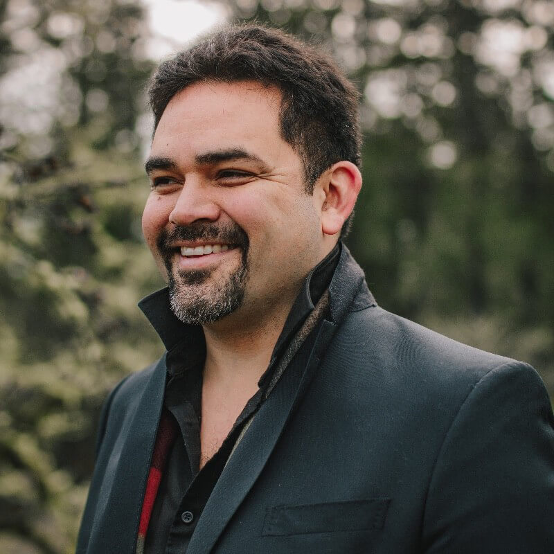 man outdoors smiling