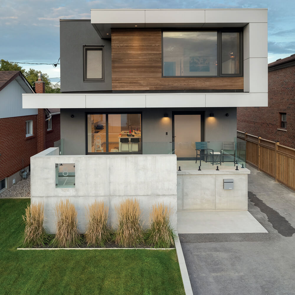 a modern looking house of wood glass and concrete