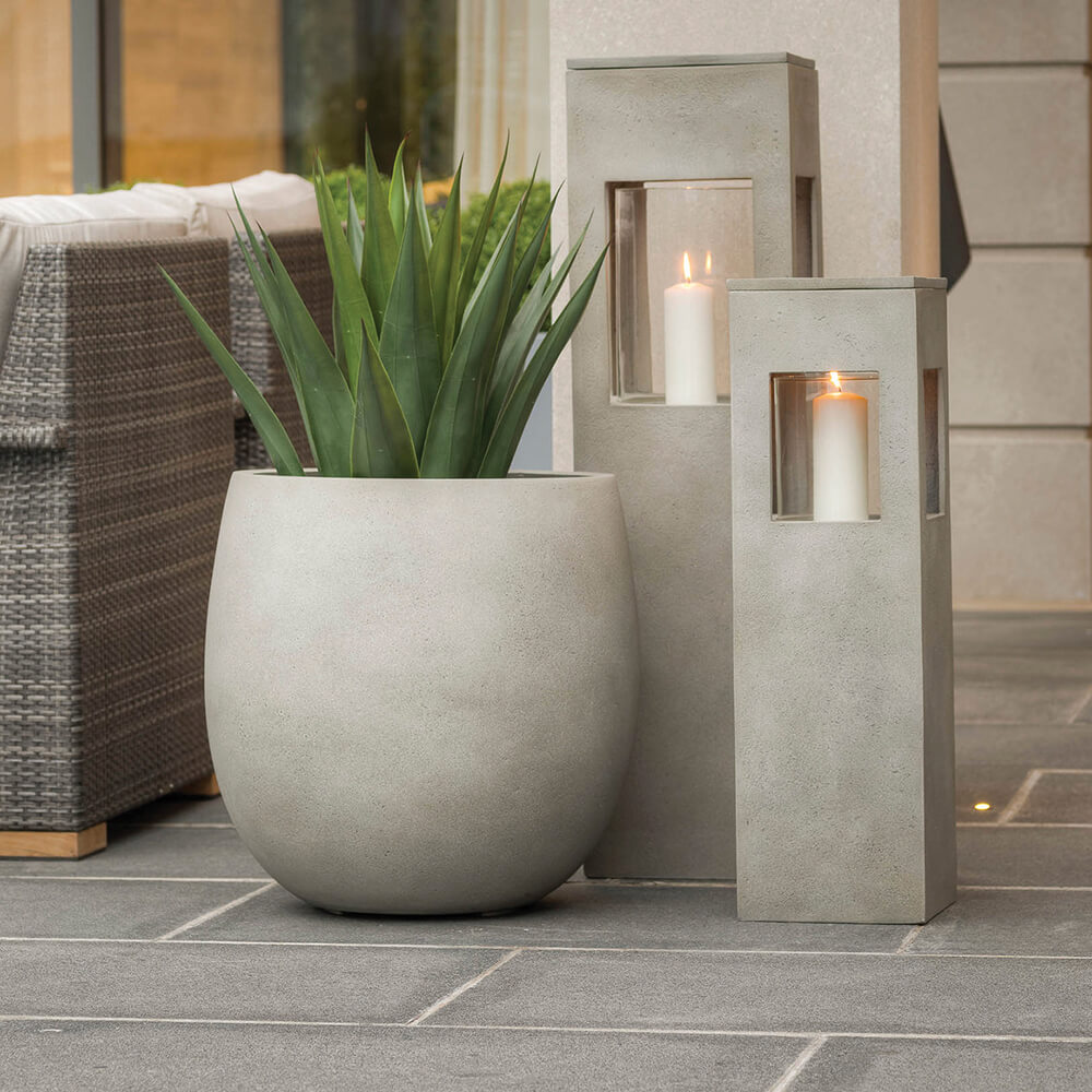 a planter and candle pedestals made of concrete