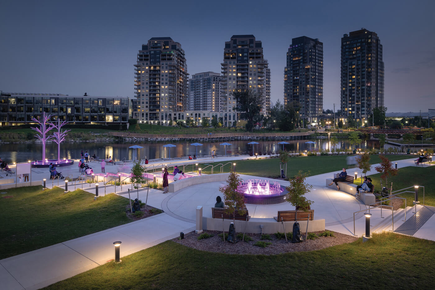 an outdoor public park by the water at night
