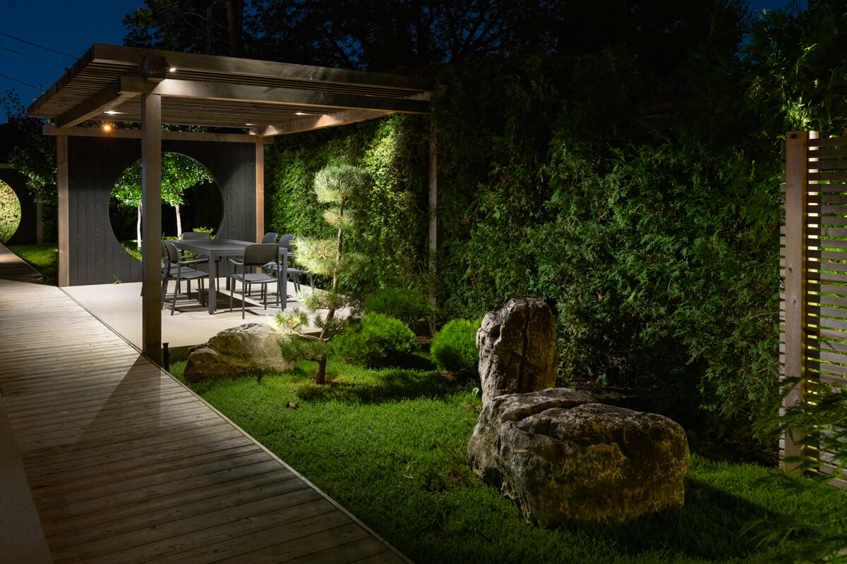 large backyard lit up at night