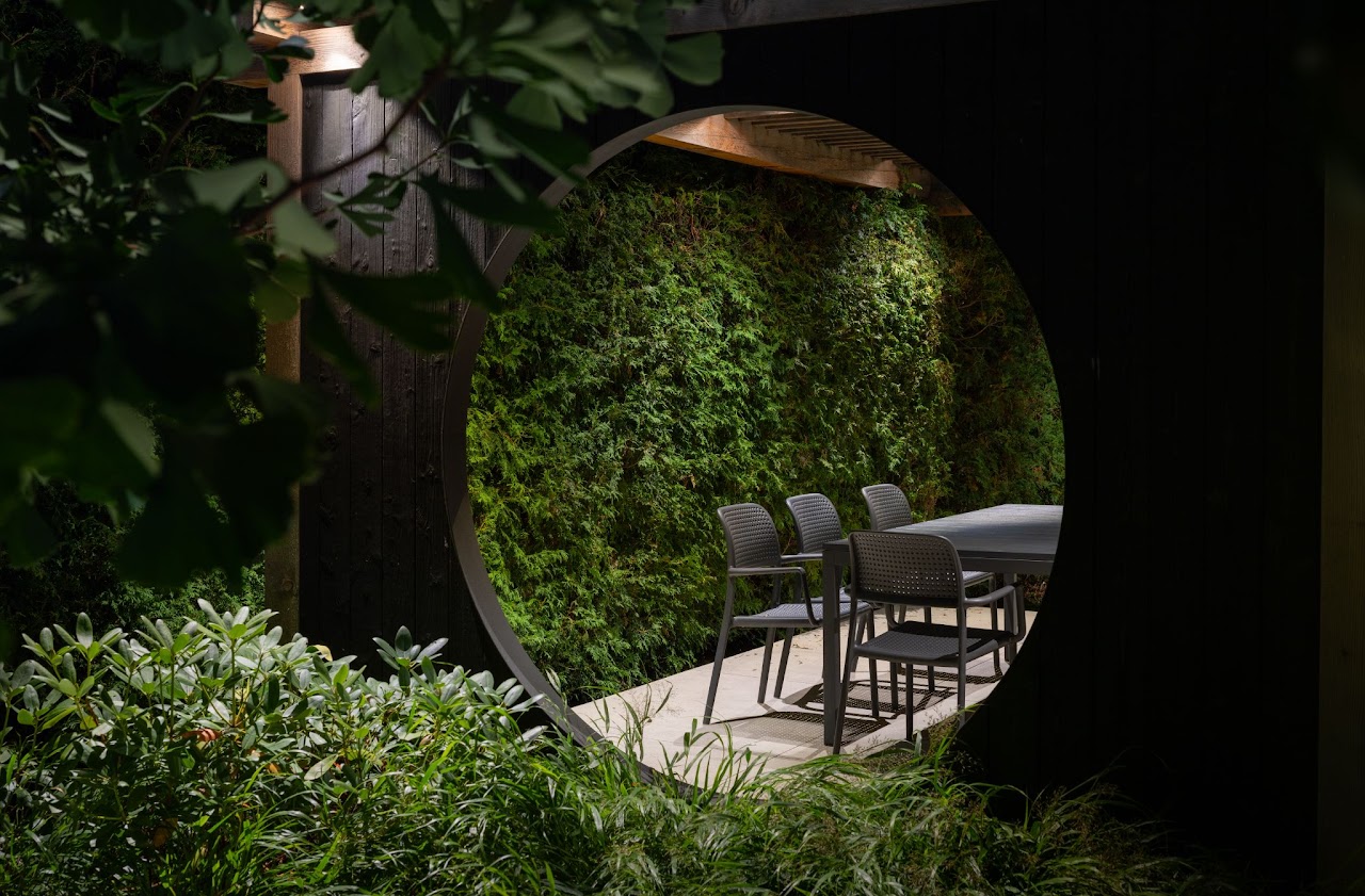 an outdoor seating area lit at night